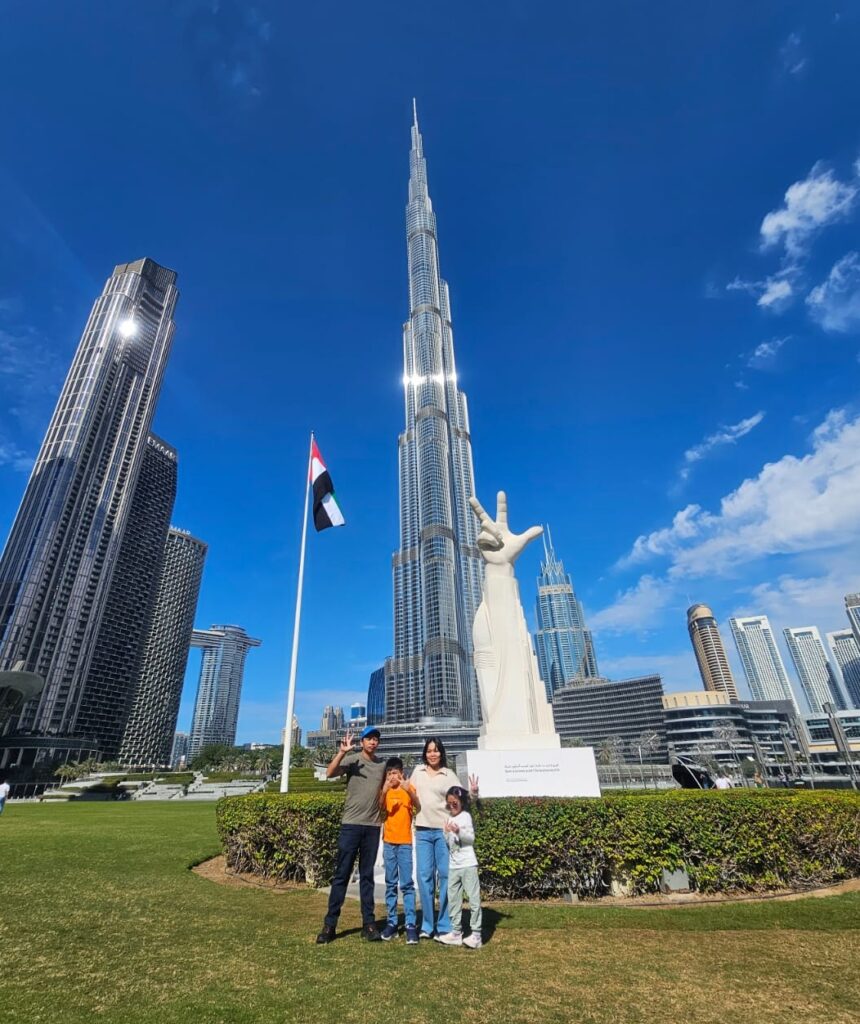 Family Pose at Win Love Victory sculpture
